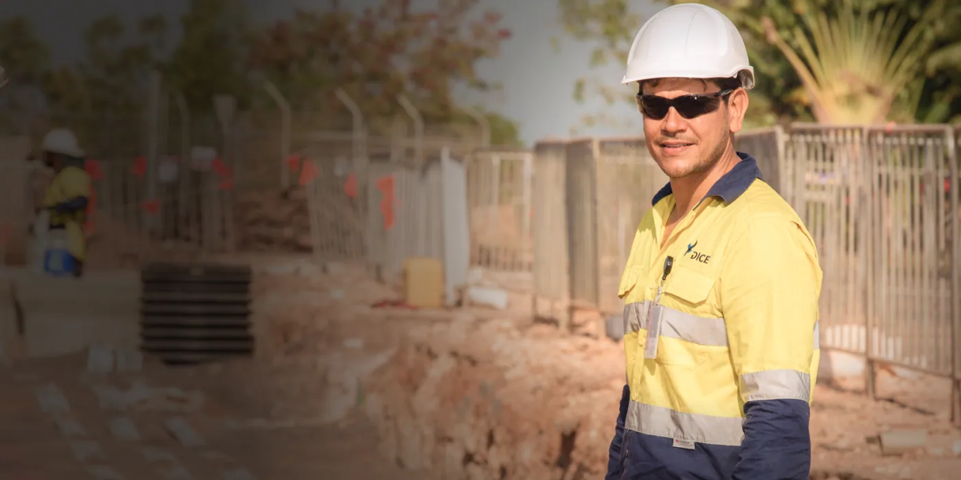 DICE Contracting worker in high-visibility vest on a construction site